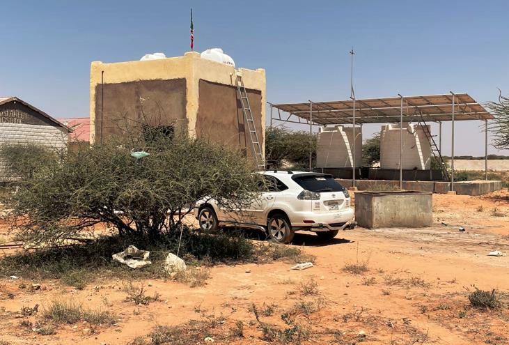 Raw water tanks with solar panels in the background